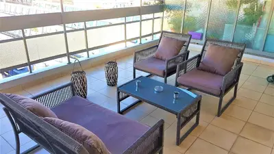 a room with three chairs and a coffee table at Yianna's Apartment in Athens