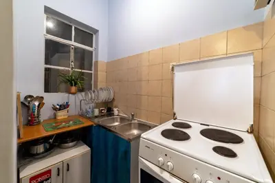 a small kitchen with a stove and a sink at Acropolis Quiet House in Athens