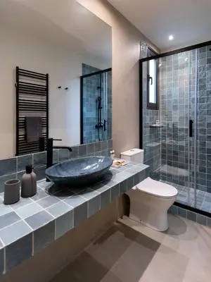 a bathroom with a sink and a toilet and a shower at Muse Urban Suites in Athens