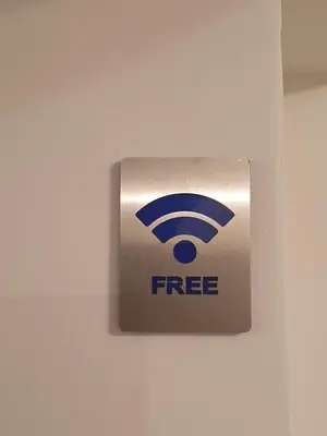 aazon free sign on a white wall at City Center Athenes rooms in Athens