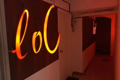 a neon sign that says boo on a wall at quiet and central FLAT with private backyard GARDEN in Athens