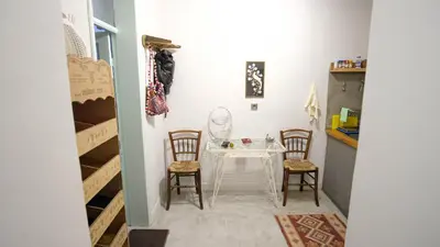a dining room with a table and chairs in a room at quiet and central FLAT with private backyard GARDEN in Athens