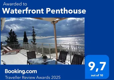a picture of a balcony with a view of the ocean at Waterfront Penthouse in Saronida