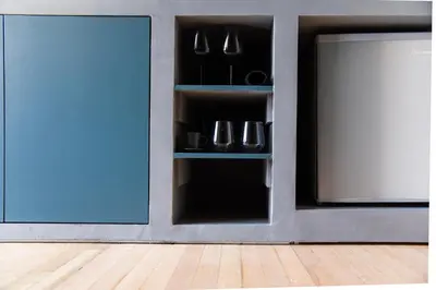 a room with a blue door and a tv at CentraL44 WoW CasuaL Suite-Ermou view in Athens