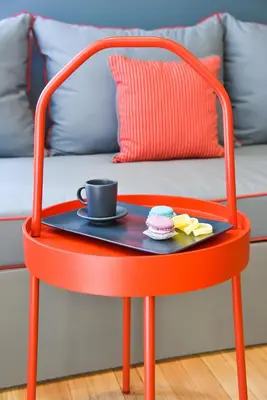a red chair with a tray with a coffee cup on it at CentraL44 OMG Casual Suite-Ermou view in Athens