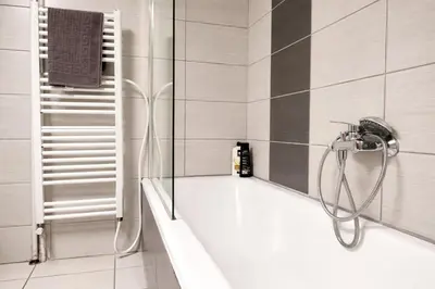 a bathroom with a shower with a glass door at Comfortable Modern Entire House near the center of Athens-Blue Serenity in Athens