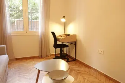 a living room with a desk and a chair and a table at Super Comfrortable Modern Apartment in Kolonaki in Athens