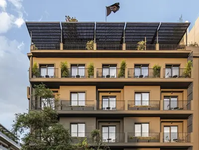a building with solar panels on the side of it at The Modernist Athens in Athens