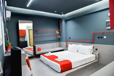 a bedroom with two beds and a mirror at CentraL44 YoLo Casual Suite- Ermou in Athens