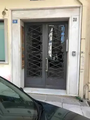 a front door of a building with a window at Omirou “Best Kept Secret” in Athens