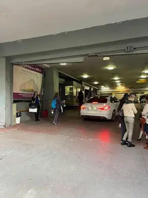a group of people standing in a parking garage at Omirou “Best Kept Secret” in Athens