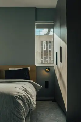 a bedroom with a bed and a window at Bango Loft Chalandri, with private parking in Athens