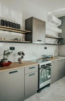 a kitchen with white cabinets and a stove at Bango Loft Chalandri, with private parking in Athens