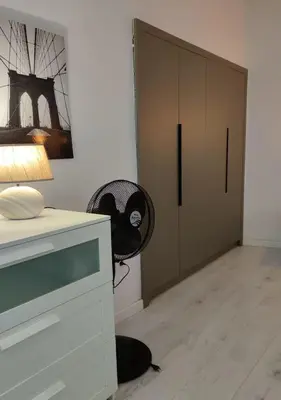 a room with a desk and a chair next to a door at Palio Faliro Deluxe Apartment near the sea in Athens