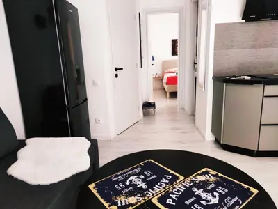 a living room with two mats on a table at Palio Faliro Deluxe Apartment near the sea in Athens