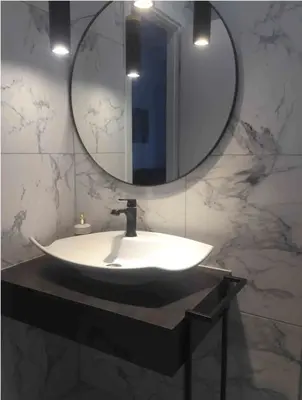 a bathroom with a sink and a mirror at Palio Faliro Deluxe Apartment near the sea in Athens