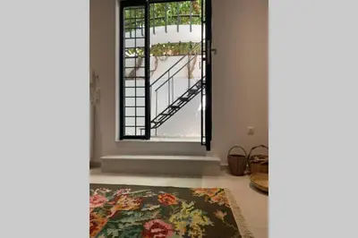 a room with a large window and a rug at Anna's House in Athens