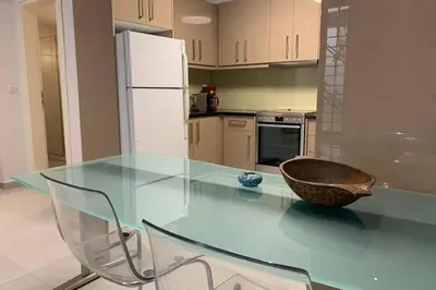 a kitchen with a glass table with a bowl on it at Anna's House in Athens
