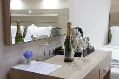 a table with two bottles of champagne and glasses at Elikon in Athens