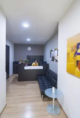a living room with a couch and a table at Elikon in Athens