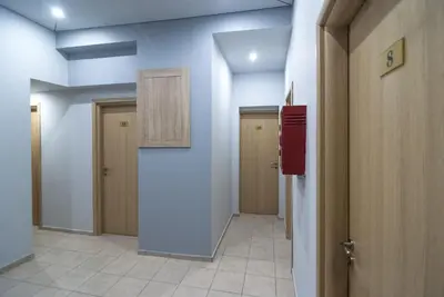 a hallway with two doors and a hallway with a hallway at Elikon in Athens