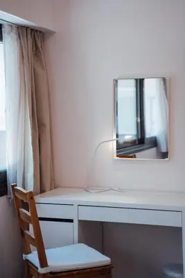 a mirror sitting on top of a desk with a chair at Luxury Apartment in Plaka - Acropolis (Rosemary) in Athens