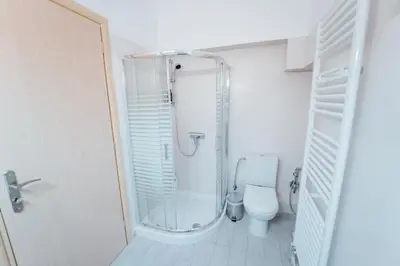 a bathroom with a toilet and a glass shower at Luxury Apartment in Plaka - Acropolis (Rosemary) in Athens