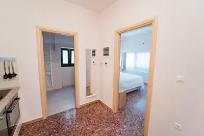 a bedroom with a bed and a mirror in a room at Luxury Apartment in Plaka - Acropolis (Rosemary) in Athens