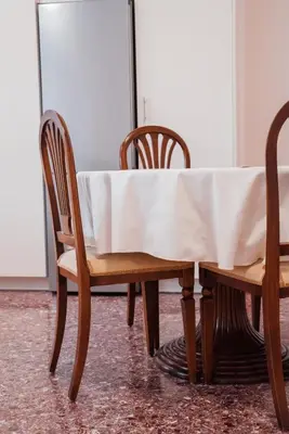 a table and chairs with a white table cloth on it at Luxury Apartment in Plaka - Acropolis (Lavender) in Athens