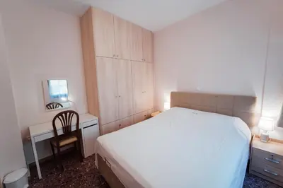 a bedroom with a bed and a desk and a chair at Luxury Apartment in Plaka - Acropolis (Lavender) in Athens