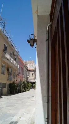 a street with a street light on the side of a building at Luxury Apartment in Plaka - Acropolis (Lavender) in Athens