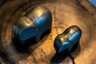 two metal knobs sitting on top of a wooden table at ACRON suites & apartments in Athens