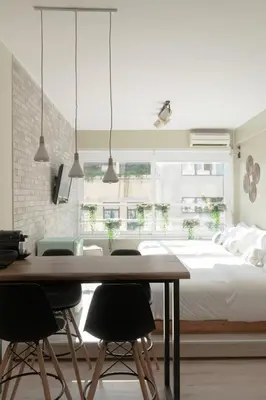 a bedroom with a bed and a table and chairs at Eunoia Suite - Monastiraki Square View in Athens