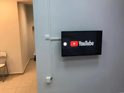 a television with the youtube logo on a wall at Athens Spirit 49 katechaki apartment in Athens