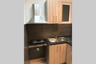 a small kitchen with a sink and a stove at Athens Spirit 49 katechaki apartment in Athens