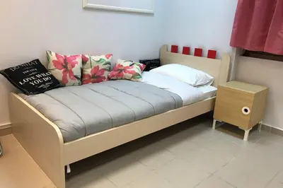 a bed with pillows on it in a room at Athens Spirit 49 katechaki apartment in Athens