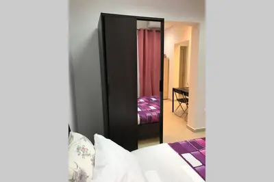 a bedroom with a mirror and a bed in a room at Athens Spirit 49 katechaki apartment in Athens