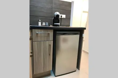 a kitchen with a counter and a dishwasher at Athens Spirit 49 katechaki apartment in Athens