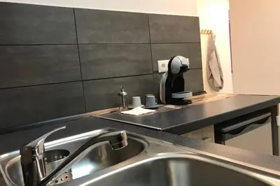 a kitchen with a sink and a counter top at Athens Spirit 49 katechaki apartment in Athens