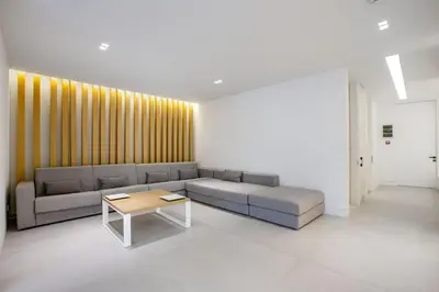 a living room with a couch and a coffee table at NS PLACE Modern Apartment Acropolis view in Athens