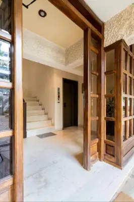 an empty room with a staircase in a house at Βright Walled Designed Apt in Glyfada Center 1Gbps in Athens