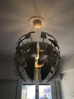 a large black chandelier hanging from a ceiling at Acropolis Exceptional View II in Athens