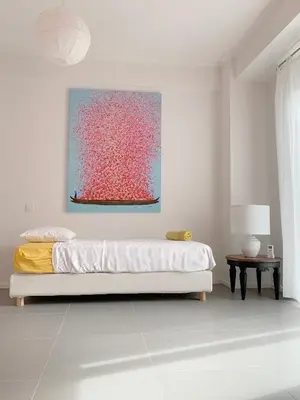a bedroom with a bed and a painting on the wall at New Modern Apartment - Athens Seaside - 3 Bedrooms in Athens