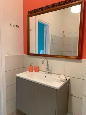 a bathroom with a sink and a mirror at New Modern Apartment - Athens Seaside - 3 Bedrooms in Athens