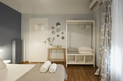 a bedroom with a bed with two pillows at Apollonos Amalia one bedroom in Athens