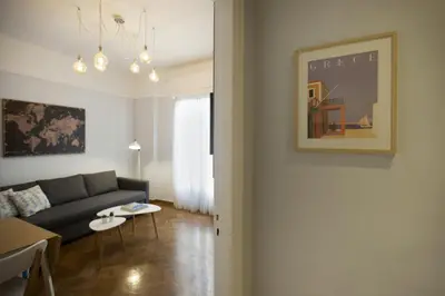 a living room with a couch and a table at Apollonos Amalia one bedroom in Athens