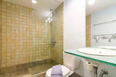 a bathroom with a sink and a toilet and a shower at Unique Apartment near Acropolis in Athens