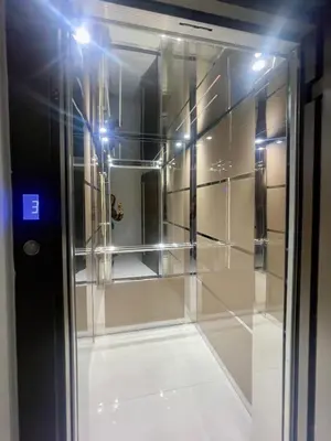 a room with a glass door with a mirror at Alimos Luxury Prestige in Athens