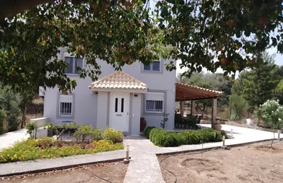 a white house with a gazebo at Studio Katafigi in Anavissos