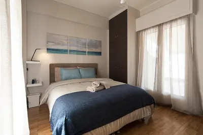 a bedroom with a bed with a stuffed animal on it at EL GRECO Penthouse in Vibrant Petralona in Athens